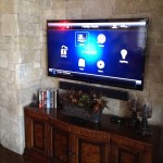 Control 4 - TV mounted on stone wall