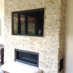Flat Screen built into stone fireplace